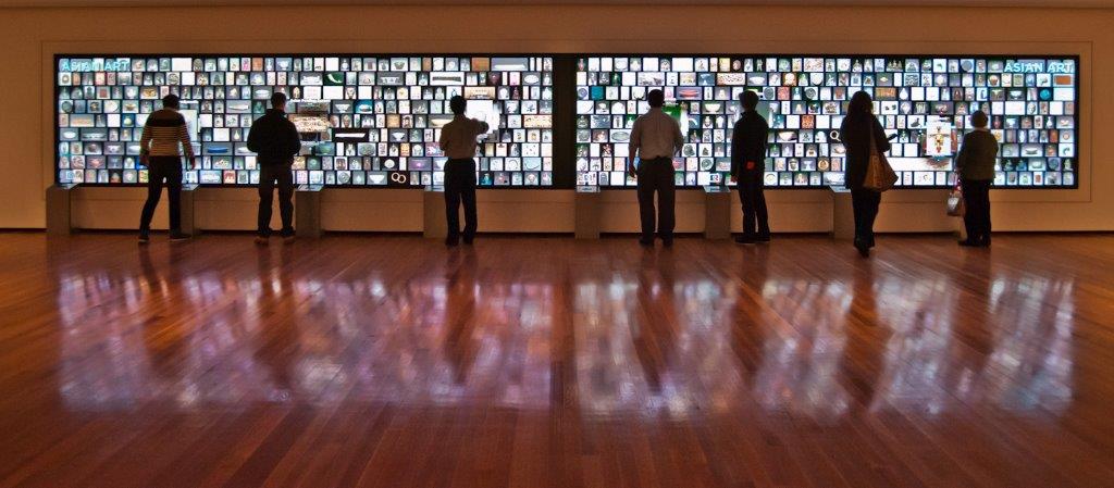 Users interact with an extra wide touch screen video wall